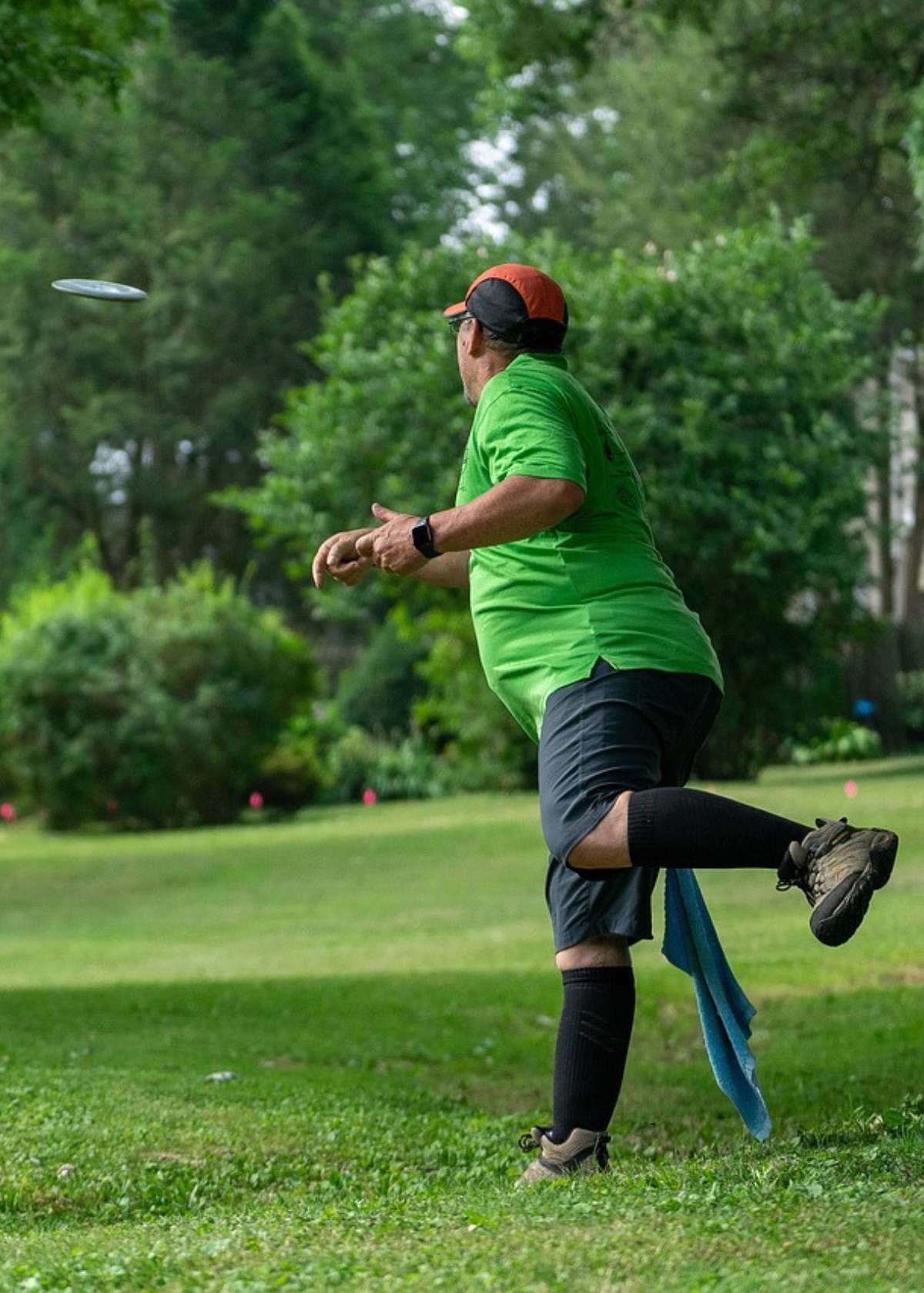 Senior disc golfer throwing