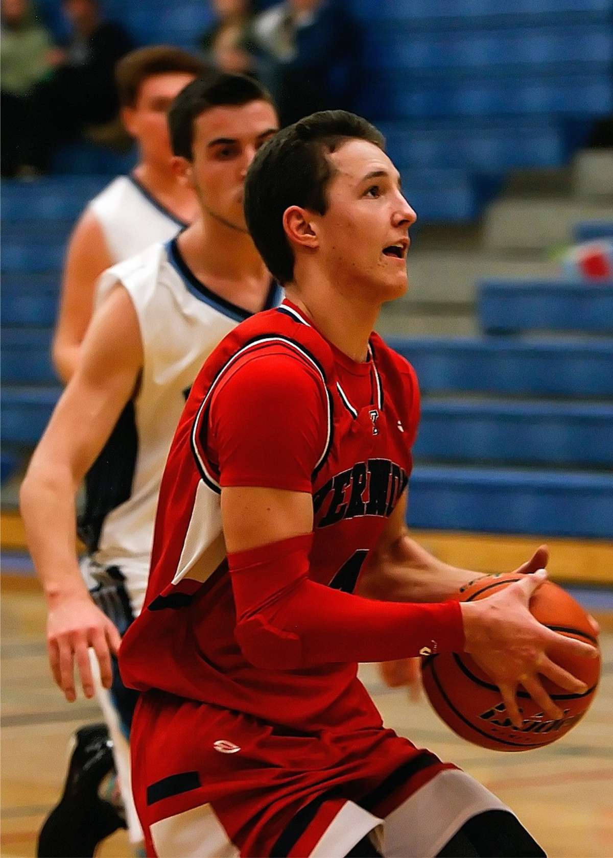 A basketball player wears an arm sleeve